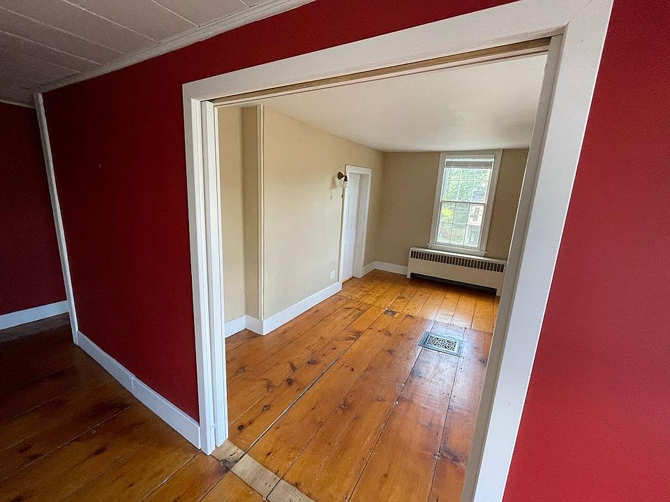 From the hallway, looking through the open pocket doors to the live/work space (or 2nd bedroom).