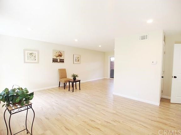 Bright entry into living room with new contemporary laminate