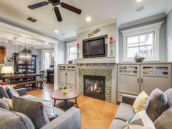 Another view of the main living area that leads into the dining area with a beautiful coffered ceiling.