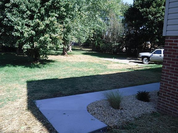 New sidewalk and landscaping- nice flat back yard