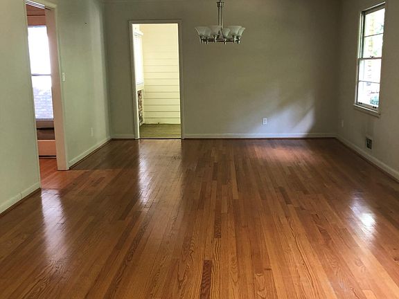 Dining room, door to sunroom with access to upper patio. One of two patios.