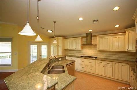 Kitchen and breakfast eating area with top level granite, stainl