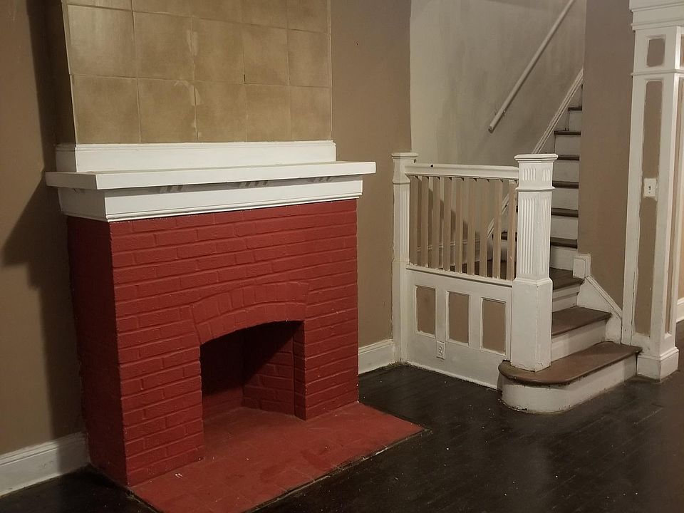 Mahogany floors and a fire place....