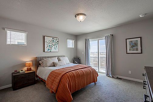 Master bedroom with eastern sun open space views from upper deck