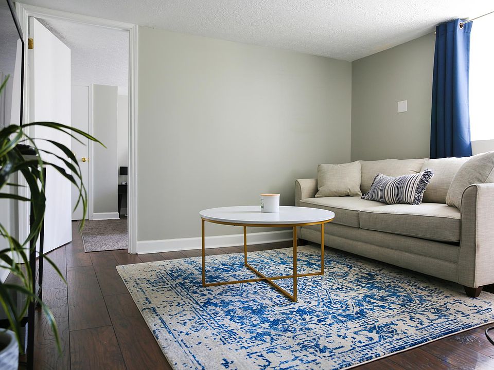 Livingroom with big window behind couch letting in nice light