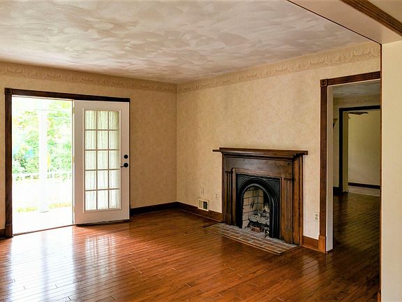 Living Room. The living room has a beautiful, gleaming hardwood floor.