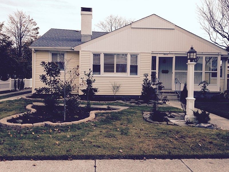 Front of house; screened in porch : Screened in porch includes glass and screen to enjoy all types o