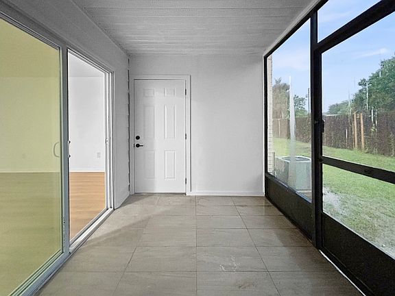 Screened in patio with extra storage unit