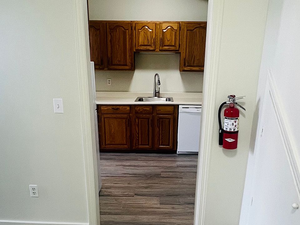 hallway with storage and new flooring.