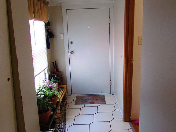 Entry and door to 1st bedroom