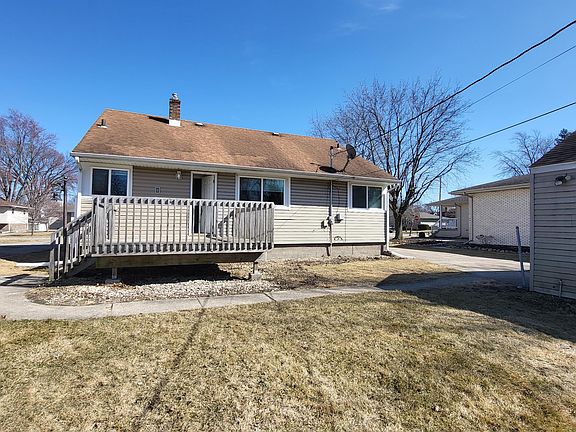 back of house with large deck as porch