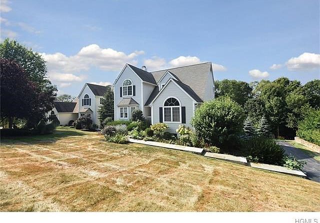 Contemporary colonial style home.  Professionally landscaped.  Picture perfect setting.