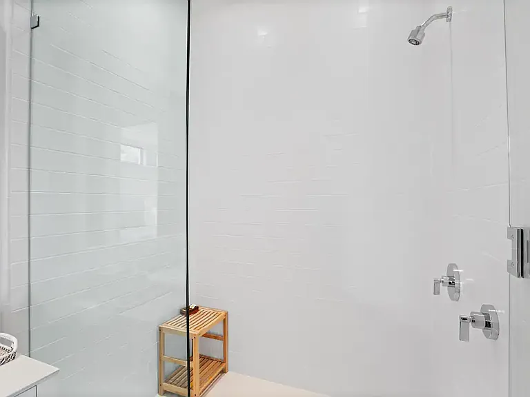 Spacious walk-in rain shower for a spa-like experience.