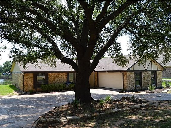 WELCOME TO AN ALL NEWLY REDONE FROM TOP TO BOTTOM ADORABLE HOME BACKING TO THE LARGE POND ON THE 14TH GREEN, ENJOY THE WATER FOUNTAIN FEATURE DAILY.