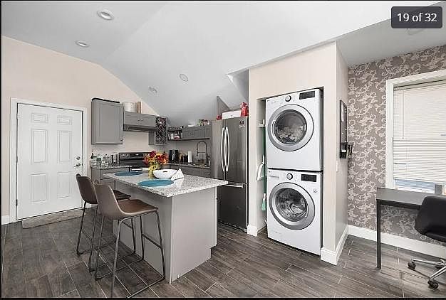 Stainless Steel Appliances with washer and dryer in unit