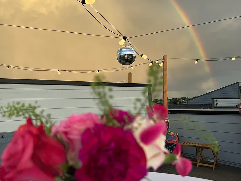 Our private 4th-floor rooftop oasis with panoramic mountain views. Please note: This photo highlights a past birthday celebration layout.