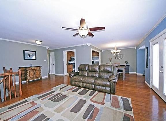 Open layout with hardwood floors has a nice flow through the family room, dining room, and kitchen. 