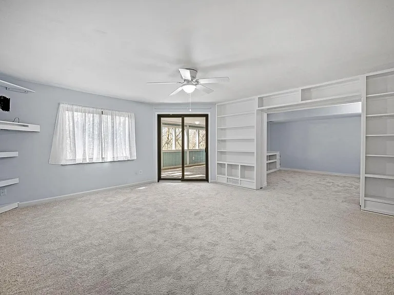 Lower level living area with walk out to screened-in-porch