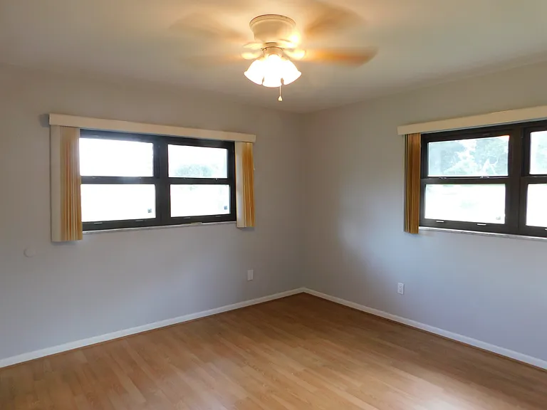 The southeast bedroom has the third ceiling fan (with light fixture) and is approximately 12.1' x 12.7'. Here we're facing southeast.