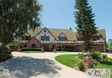 Stunning majestic custom home located in an exclusive area on almost one acre of land zoned for horses.. Pool/Spa and Gazebo and large grass area plus a barn that matches the house and large turn out area got the horses!