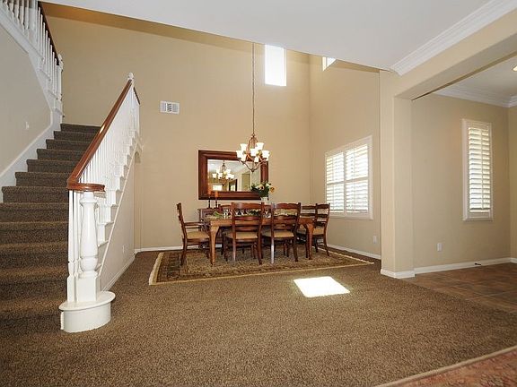Formal dining with vaulted ceilings