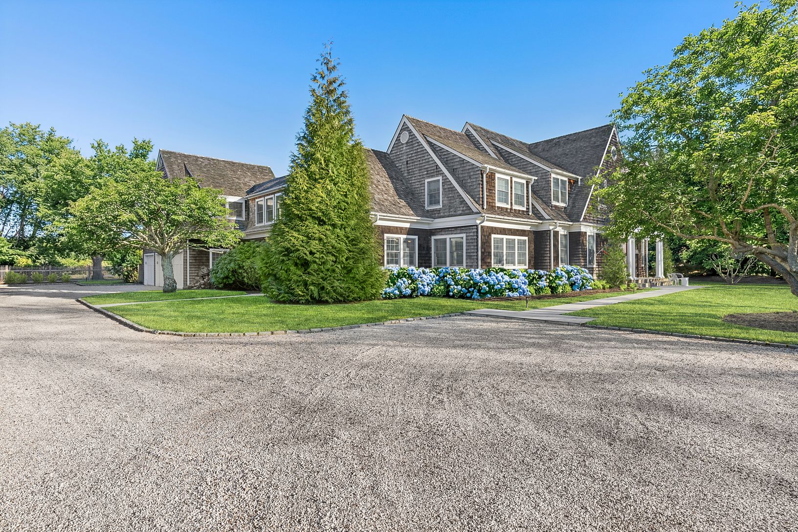 Spacious with 3-car garage tucked on side