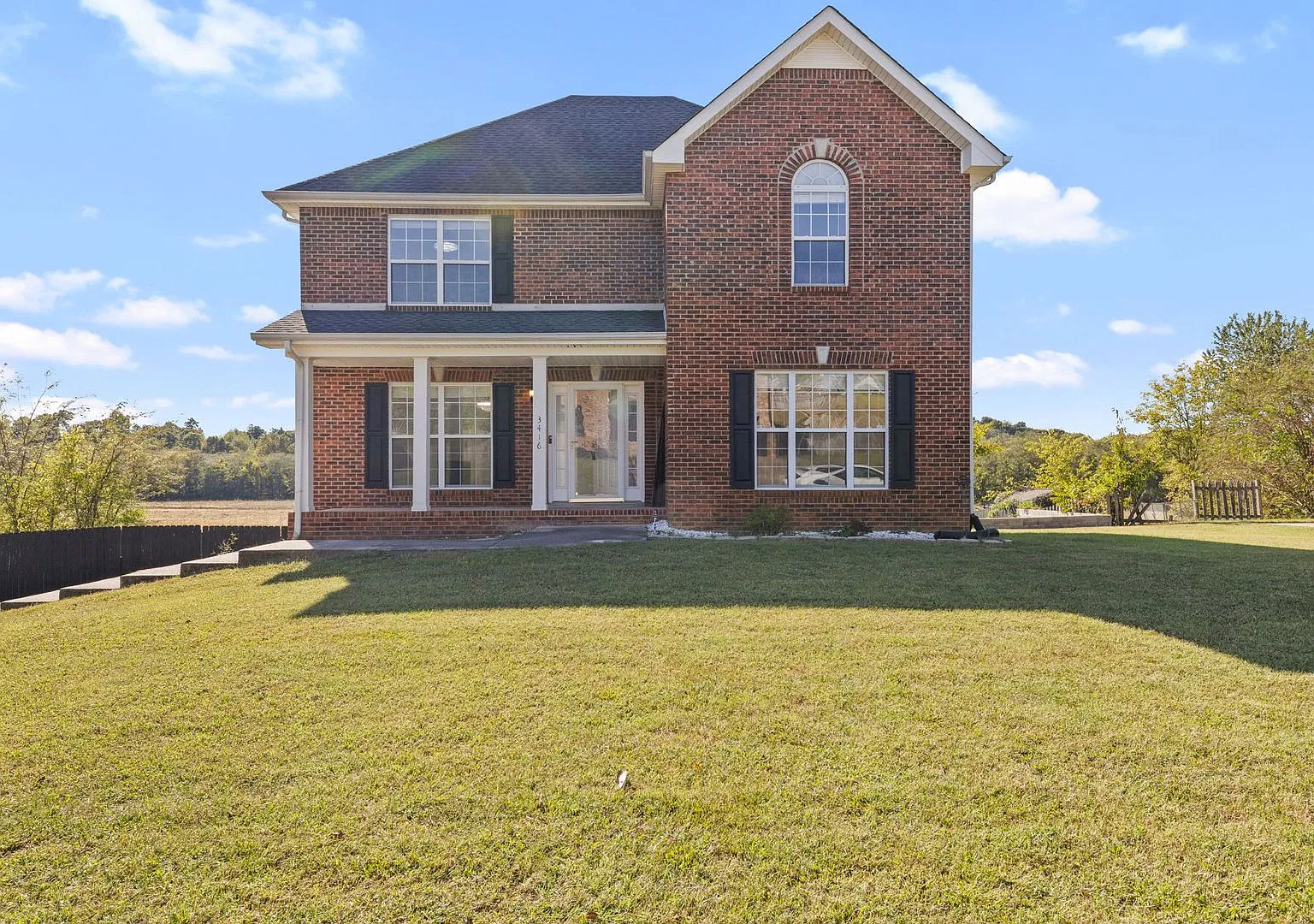 Beautiful Brick Home with Finished Basement & Spacious Living Areas — Photo 1