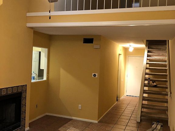 Open great room with loft area and fireplace