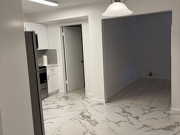 Dining area view to kitchen and family room