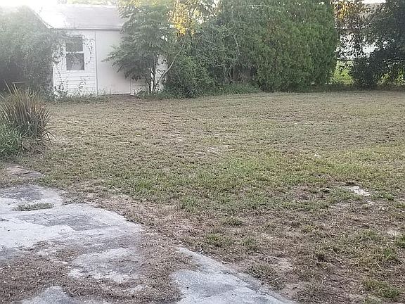 Backyard chain link fence shed