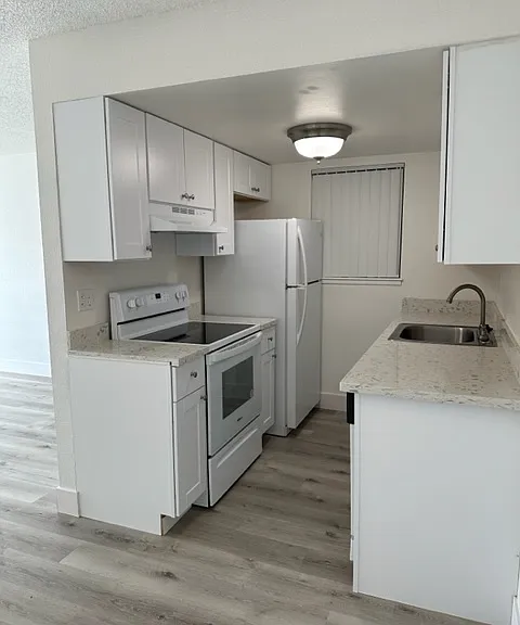 Remodeled kitchen with granite countertops and energy efficient appliances