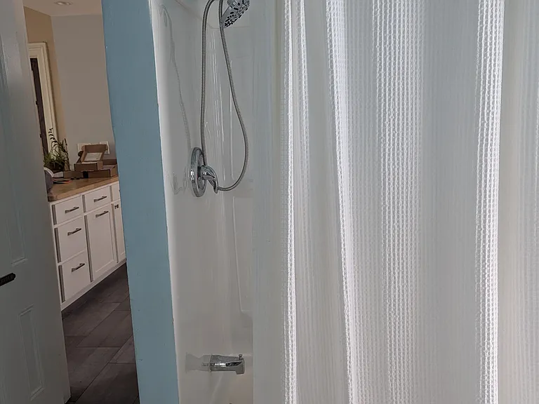 From the bedroom door, facing the kitchen