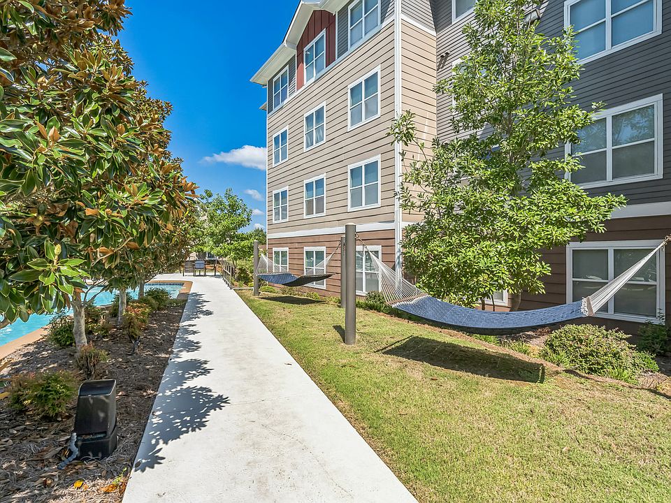 Relax and unwind in the peaceful hammock garden at The Flatts Starkville, offering a serene escape just steps from your student apartment.