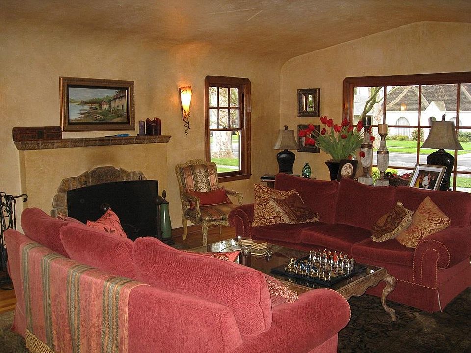 formal Living room with wood burning fireplace, hardwood floors, two sofas