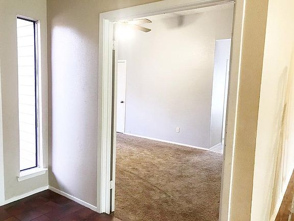 Double doors open to spacious master suite.