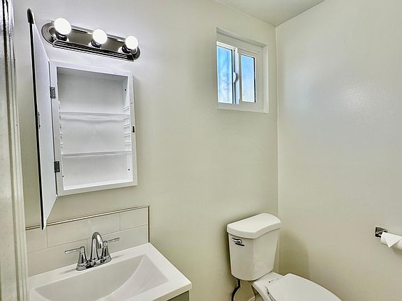 Enjoy the convenience of your downstairs half bathroom, ideal for hosting your guests