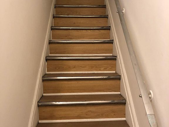Interior stairs leading to the apartment.