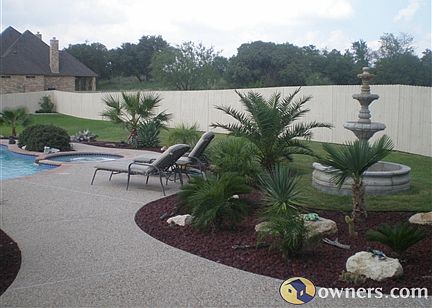 View on the right side of pool area, a working fountain included