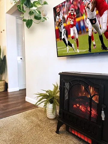 Electric fireplace below the TV.