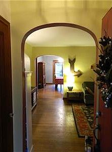Entrance through front door, showing off the beginning of the many arches.