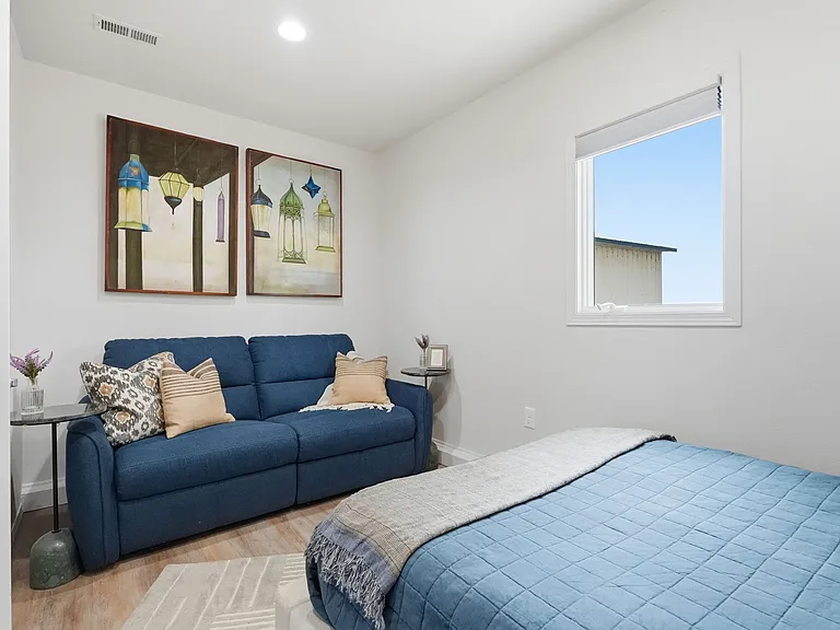 Bedroom 3 w/ dual motorized reclining sofa.