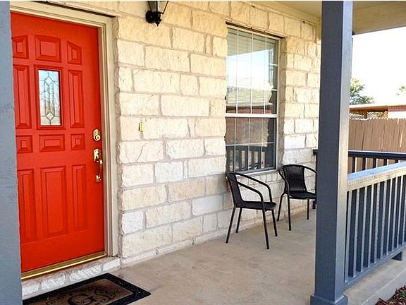 Covered front porch. Keyless entry. Love the red door!