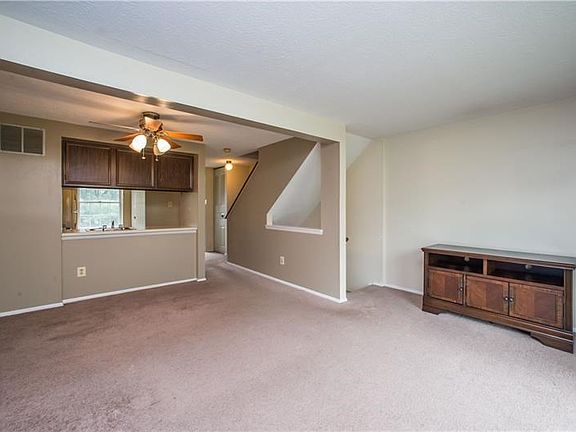 Open concept living room, dining room and kitchen.