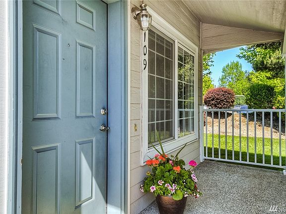 Charming covered porch welcomes you home! 