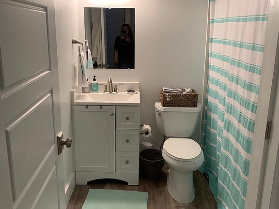Full sized bathroom with closet for storage