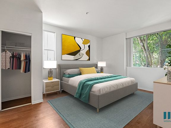 Bedroom with Mirrored Closet, Vinyl Flooring, and Large-Size Windows