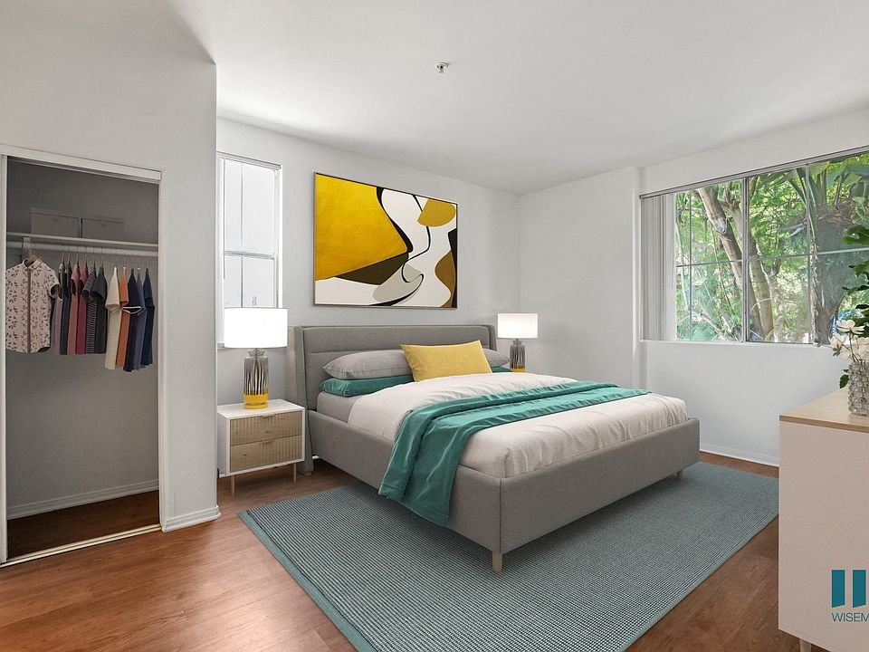 Bedroom with Mirrored Closet, Vinyl Flooring, and Large-Size Windows