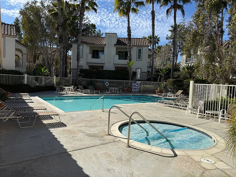 Condominium pool and hot tub.
