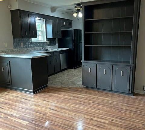 View from den into dining area and kitchen