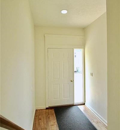 Welcoming entry hall has beautiful hardwood floors!